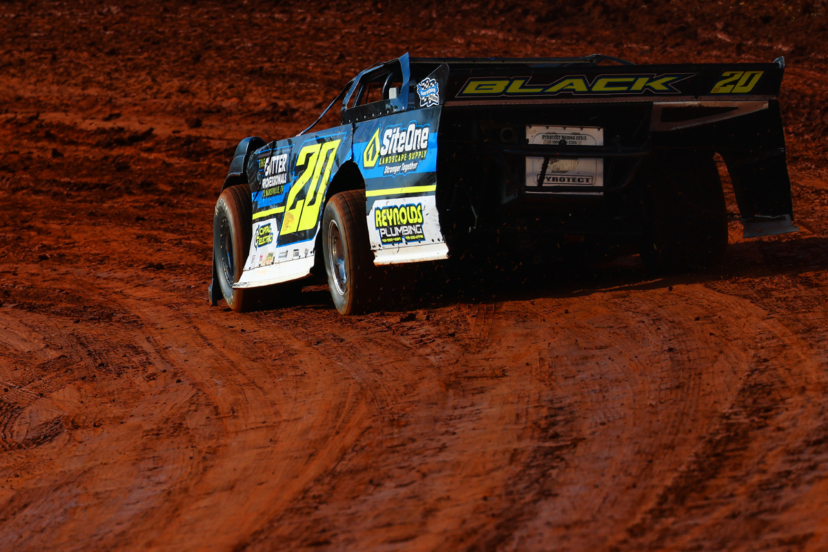 A DIRTcar Pro Late Model takes a qualifying lap during a dirt racing event