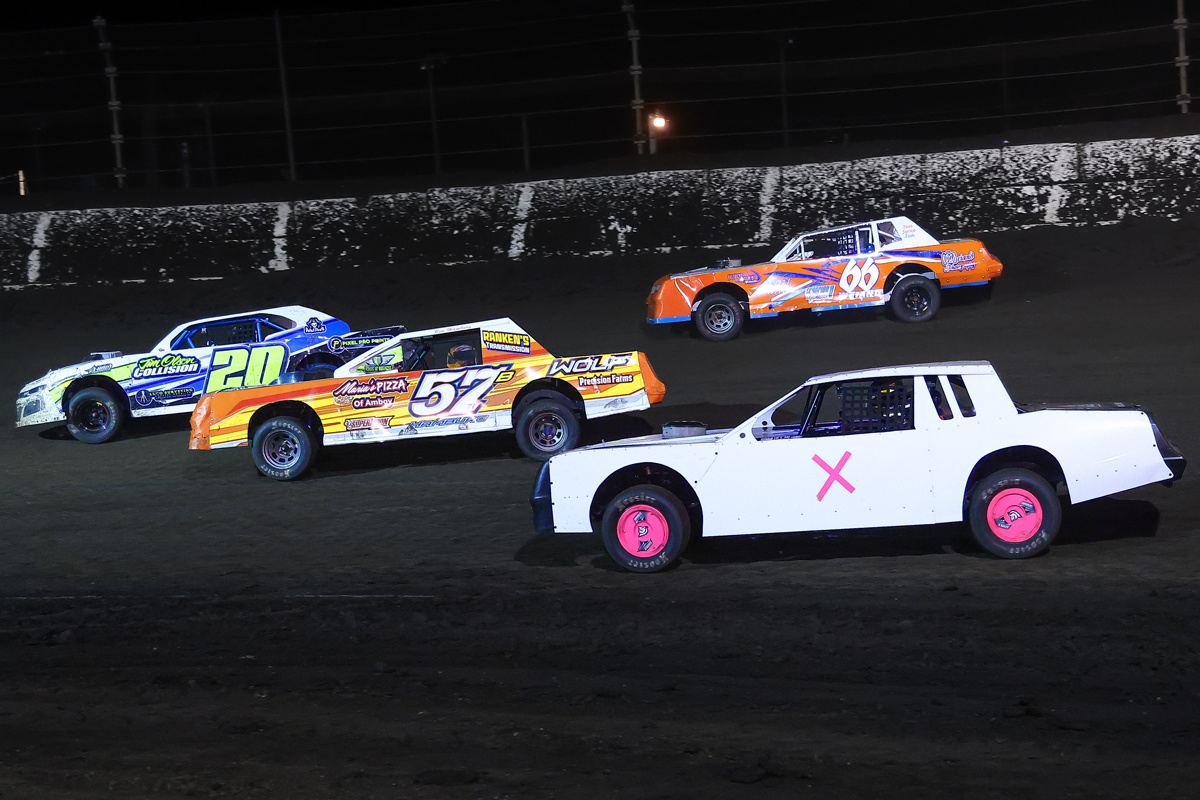 DIRTcar Street Stocks compete during the Last Chance Qualifier race at a dirt racing event. 